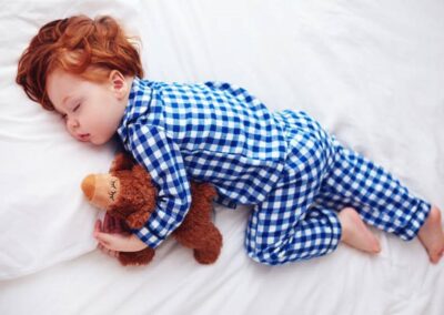 toddler asleep in bedding Australia bed